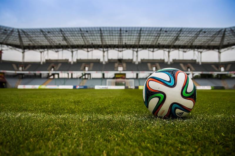 content soccer ball on grass field during daytime 467981